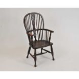 A 19th century Windsor kitchen armchair