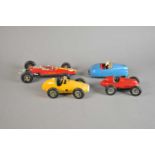A collection of four Schuco clockwork model cars