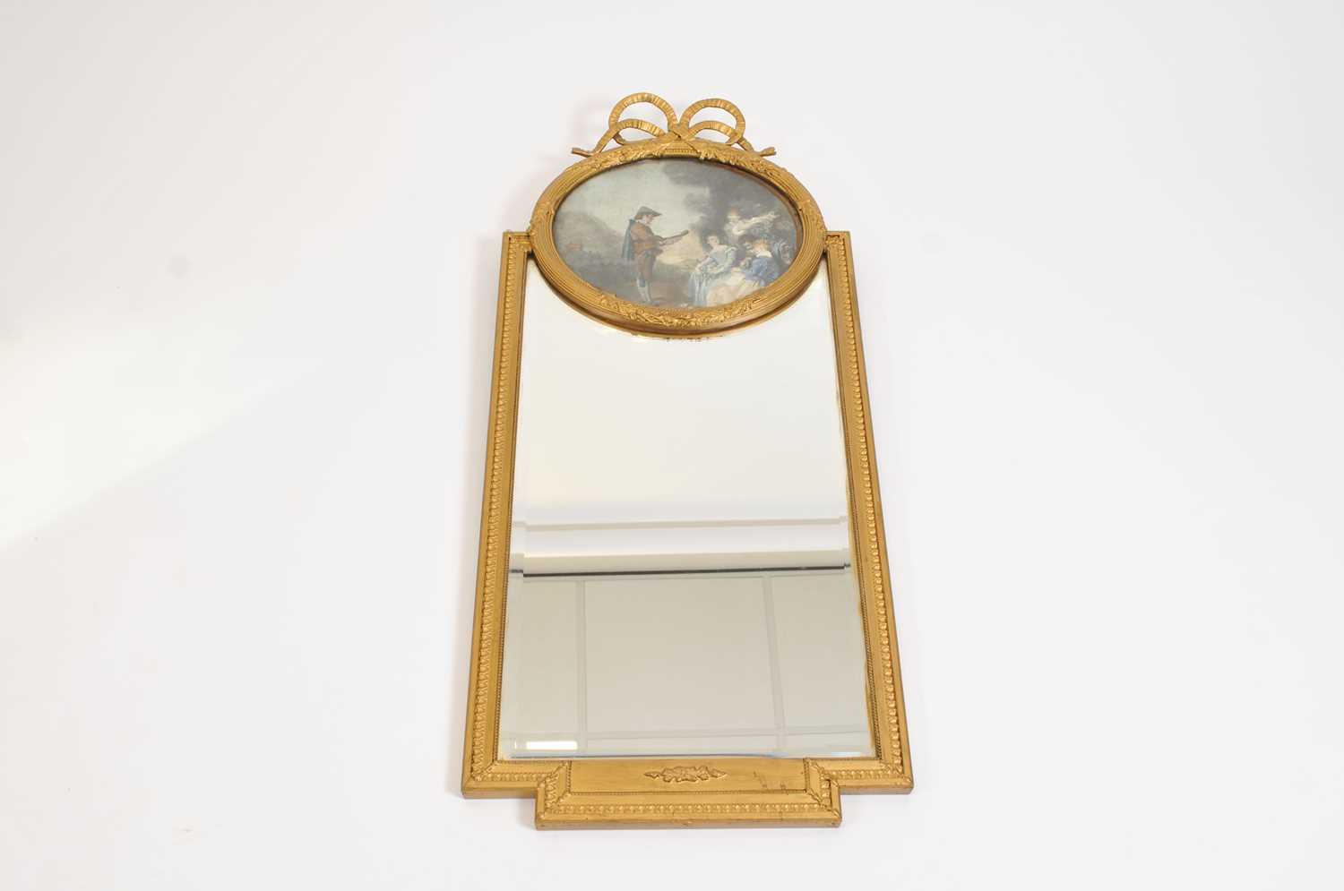 A decorative early 20th century French pier glass