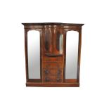 An Edwardian mahogany triple wardrobe