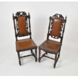 A set of eight Victorian carved oak dining chairs