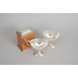 A pair of silver mounted pedestal bon bon dishes