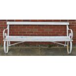 A large iron framed garden bench