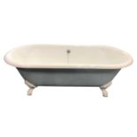 A painted and enamelled cast iron claw-footed bath tub