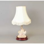 A decorative figural desk lamp.