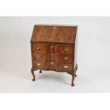 A small Queen Anne style walnut veneered bombe-fronted bureau