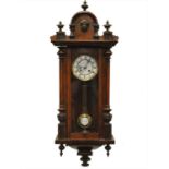 A walnut cased Vienna wall clock