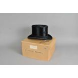 A boxed black top hat by Dunn & Co