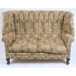 A Victorian wing back sofa