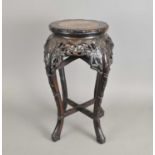 A 19th century Chinese marble-topped carved hardwood jardinière stand