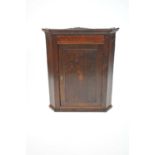 A country oak corner cupboard,