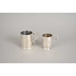 Two Victorian silver mugs