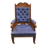 An upholstered oak armchair, 110 cm high, 67 cm wide, 67 cm deep.