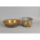 A 19th century pierced brass planter and a heavy brass bowl