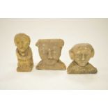 A stylised carved limestone figure and two stylised limestone busts
