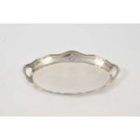 A two handled oval silver tray