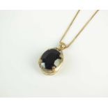 A black spinel and white topaz pendant on chain