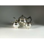 A three piece silver tea service