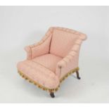 A small Victorian upholstered armchair, with rolled arms, upholstered in a buttoned pink floral