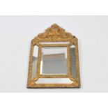 A Victorian style gilt framed cushion framed wall mirror, 57 x 34cm.