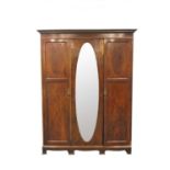 An Edwardian mahogany tripple wardrobe, with central mirror (A/F) 213cm high, 160 x 50cm.