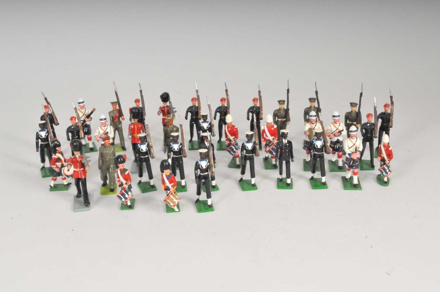 A collection of cast metal soldiers, attributed to Britains, various nations and regiments, to