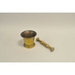 A large 19th century cast brass pestle and mortar, the mortar measuring 14cm high, 14cm diameter,