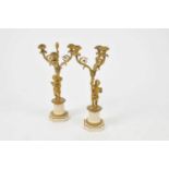 A pair of 19th century three-divisional gilt metal and white marble candelabra, each in the form