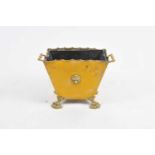 A heavy brass coal bin, of tapering rectangular form, with shaped rim flanked by handles, with