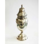 A silver sugar caster