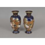 A pair of Royal Doulton Slaters Patent baluster vases, decorated with pink and white flowers against
