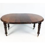 A Victorian Mahogany wind-out extending dining table