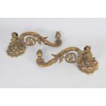 A pair of adjustable heavy cast brass lamp sconces (electrifiied) with scrolling arms, 37 x 17cm.
