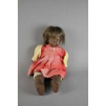 A 20th century straw-filled jointed doll