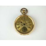 A yellow metal open face pocket watch