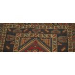 Dosemealti rug, west Turkey, the blood red field with three crucifoirm medallions, enclosed by