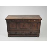 A 17th/18th century oak mule chest, with applied 'nail' headings, 12 x 50 x 71cm high