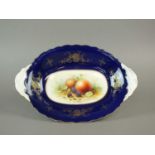 A Coalport oval dish painted with fruit by F. Howard