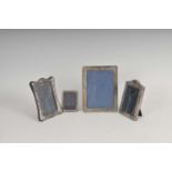 A collection of four silver mounted photograph frames