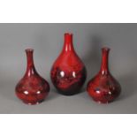 Three flambe woodcut vases