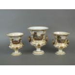 A garniture of three Derby named view vases, early 19th century