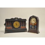 A late 19th / early 20thc century American black mantle clock, of architectural form, simulating