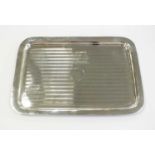 An Art Deco silver dressing table tray