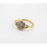 An early 20th century seven stone diamond floral cluster ring