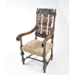 A late Victorian, restoration style, oak pierced and carved armchair