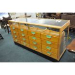 A 20th century glazed shop haberdashery cabinet, fitted with sixteen drawers, 92cm high, 178 x