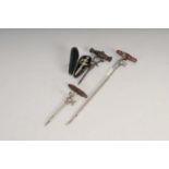 Four antique champagne taps, to incldue a small cased example (unmarked) 9.5cm long, another