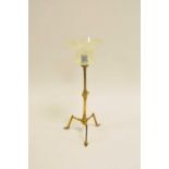 Attributed to W.A.S Benson, a brass table/wall lamp, on adjusting angular tripod foot, with a flared