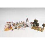 A mixed collection of hand-painted plastic models, figures and settings in various scales to include