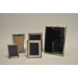A collection of five silver mounted rectangular photograph frames